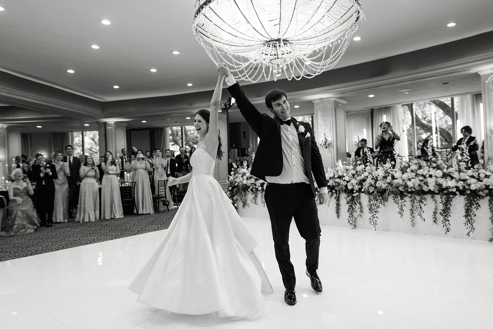 Bride and groom celebrate their Hotel ZaZa Houston wedding in the Phantom Ballroom.